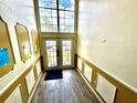 Building interior showing a tiled hallway with doors at 3970 Versailles Dr # 3970B, Orlando, FL 32808