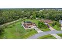 House with pool and shed on a large lot with mature trees at 636 Koala Ct, Poinciana, FL 34759