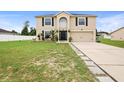 Two-story house with a landscaped lawn and driveway at 3227 Shingler Ter, Deltona, FL 32738