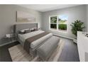 Main bedroom with plush carpet, large window, and plenty of natural light at 920 Benjamin Trl, Davenport, FL 33837