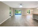 Bright and spacious living room with sliding glass doors leading to the backyard at 920 Benjamin Trl, Davenport, FL 33837