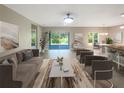 Open living room with access to the backyard at 920 Benjamin Trl, Davenport, FL 33837