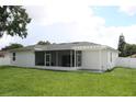 Spacious backyard with covered patio and screened enclosure at 1148 Bancroft St, Deltona, FL 32725