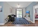Living room with sofa, rug, TV, and sliding glass doors at 3174 Feltrim Pl # 104, Kissimmee, FL 34747