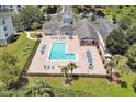 Aerial view of community pool, clubhouse, and parking at 3174 Feltrim Pl # 104, Kissimmee, FL 34747