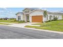 Modern two-story home with attached garage at 197 Valencia Ridge Dr, Auburndale, FL 33823