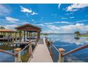 Covered waterfront dock with boat lift at 4118 Isle Vista Ave, Belle Isle, FL 32812