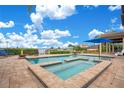 Resort-style pool and spa with lake views at 4118 Isle Vista Ave, Belle Isle, FL 32812