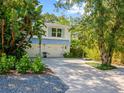 Home exterior with double garage and landscaped yard at 807 E 23Rd Ave, New Smyrna Beach, FL 32169