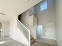 Bright entryway with staircase and tile flooring at 4373 Sagefield Dr, Harmony, FL 34773