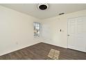 Bright bedroom with wood floors and a ceiling fan at 5467 Vineland Rd # 6308, Orlando, FL 32811
