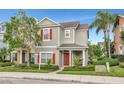 Two-story townhome with red shutters and a front porch at 1383 Alston Bay Blvd, Apopka, FL 32703