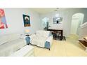 Living room with couches and a dining area at 2214 Calabria Ave, Davenport, FL 33897