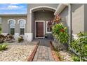 Front entry with a brick walkway and well-manicured landscaping at 4814 Terra Sole Pl, St Cloud, FL 34771