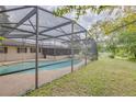 Screened-in pool area with a spacious backyard at 1522 Gainesville Dr, Deltona, FL 32725