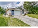 House exterior with solar panels and a large yard at 1522 Gainesville Dr, Deltona, FL 32725