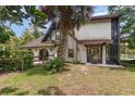 Side view of the house, showcasing the pool and patio area at 5006 Cub Lake Dr, Apopka, FL 32703