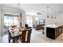 Open concept dining area with kitchen view at 1224 Challenge Dr, Davenport, FL 33896