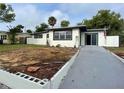 Newly renovated home with updated landscaping and driveway at 1122 Lewis Dr, Daytona Beach, FL 32117
