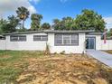 Updated Ranch home with fresh paint, new windows and landscaping at 1122 Lewis Dr, Daytona Beach, FL 32117