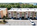 Aerial view of modern townhomes with ample parking at 7527 Brooklyn Dr # 7527, Kissimmee, FL 34747