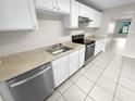 Kitchen with white cabinets, stainless steel appliances at 220 Cherokee Ct # 107, Altamonte Springs, FL 32701