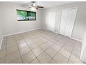 Bright bedroom with tile flooring and double closets at 220 Cherokee Ct # 107, Altamonte Springs, FL 32701