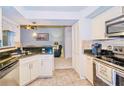 Kitchen boasts granite countertops, stainless steel appliances, and ample cabinet space at 5924 White Egret Ln, Orlando, FL 32810