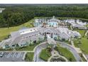 Resort-style community pool and clubhouse with ample parking at 2476 Pine Preserve Ct, St Cloud, FL 34771