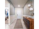 Elegant entryway with modern dresser at 2031 Lelani Cir, Davenport, FL 33897