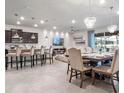 Open concept kitchen with island and dining area at 2031 Lelani Cir, Davenport, FL 33897