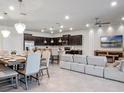 Spacious living area with kitchen and dining area at 2031 Lelani Cir, Davenport, FL 33897