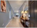 Bright entryway with tile floors and a console table at 8804 Macapa Dr, Kissimmee, FL 34747