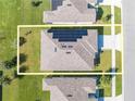 Overhead view showcasing a house with solar panels on the roof at 1475 Haines Dr, Winter Haven, FL 33881