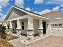 Front view of a charming house with a porch at 5013 Center Ct, St Cloud, FL 34772