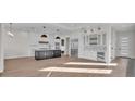 Modern kitchen with island, stainless steel appliances, and white cabinetry at 1917 S Lakemont Ave, Winter Park, FL 32792