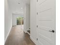 Interior hallway with stairs and a modern door at 1919 S Lakemont Ave, Winter Park, FL 32792