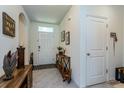 Inviting entryway with a console table and wood-toned accents at 25 Bahia Crse, Ocala, FL 34472