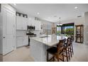 Modern kitchen featuring white cabinets, an island, and stainless steel appliances at 919 Braewood Dr, Clermont, FL 34715