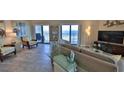 Spacious living room with ocean view and comfortable seating at 5207 S Atlantic Ave # 1226, New Smyrna Beach, FL 32169