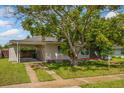 Updated house exterior with carport and landscaping at 1364 E Hancock Dr, Deltona, FL 32725