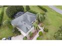 Aerial view showcasing the home's roofline, pool, and large backyard at 25013 Derby Dr, Sorrento, FL 32776