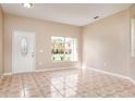 Bright and airy living room with tile flooring and an entrance at 2526 Jasmine Trace Dr, Kissimmee, FL 34758