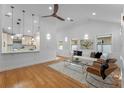 Bright and airy living room with hardwood floors and open concept kitchen at 1616 E Marks St, Orlando, FL 32803