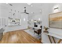 Open living room with hardwood floors and a stylish modern aesthetic at 1616 E Marks St, Orlando, FL 32803