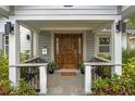 Inviting front porch with a stylish door and ample seating at 1616 E Marks St, Orlando, FL 32803