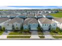 Community view showcasing multiple two story houses at 3625 Lily Ln, Davenport, FL 33897