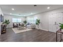 Bright living room with hardwood floors and comfortable seating at 905 Marabon Ave, Orlando, FL 32806