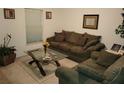 Cozy living room featuring a comfy sofa and coffee table at 15507 Willet Ct, Mascotte, FL 34753