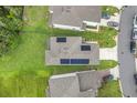 Aerial view of house with solar panels on the roof at 1001 Rivers Crossing St, Clermont, FL 34714